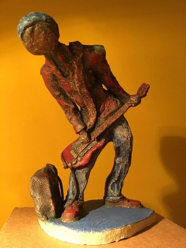 Ceramic sculpture of a punk guitarist