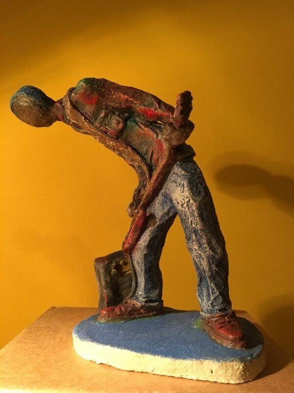 Ceramic sculpture of a punk guitarist