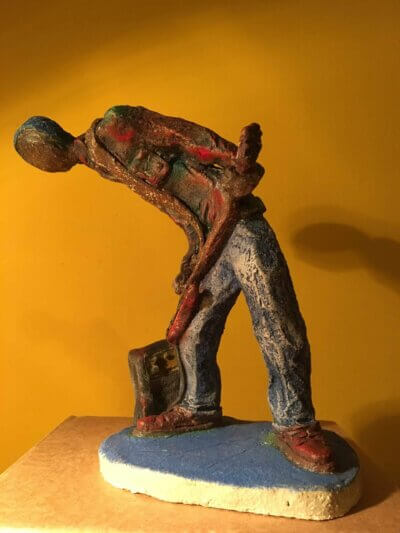 Ceramic sculpture of a punk guitarist