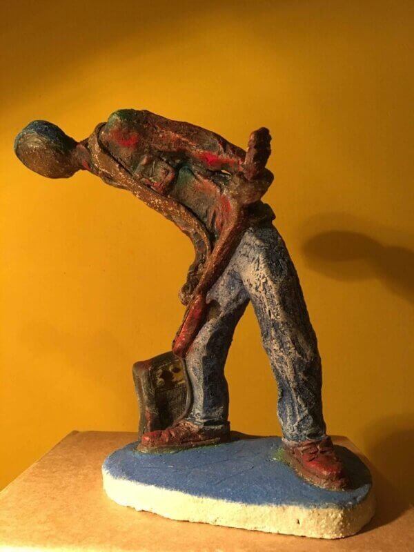 Ceramic sculpture of a punk guitarist