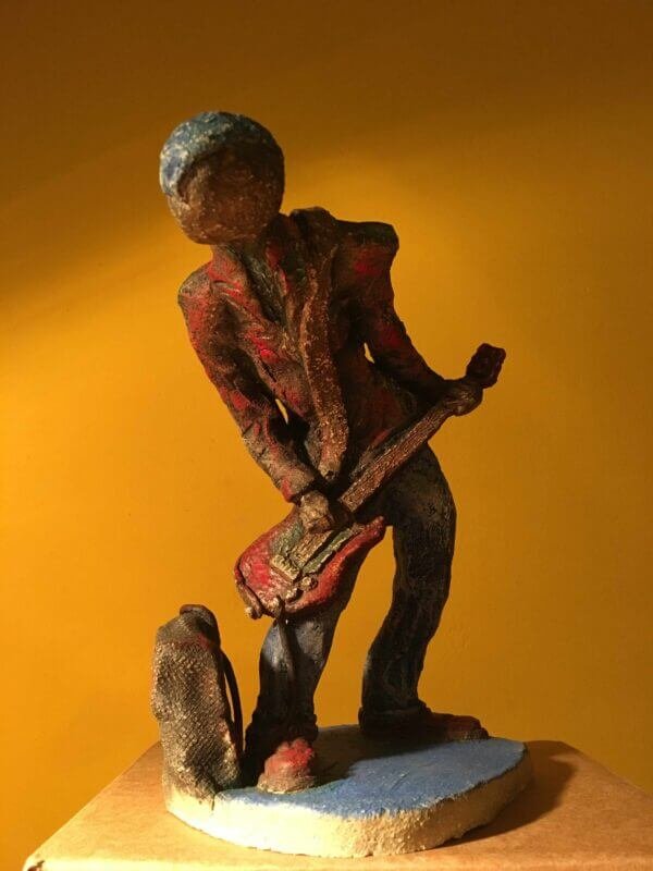 Ceramic sculpture of a punk guitarist