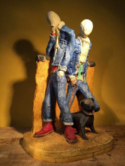 Ceramic sculpture of two skinheads with a dog