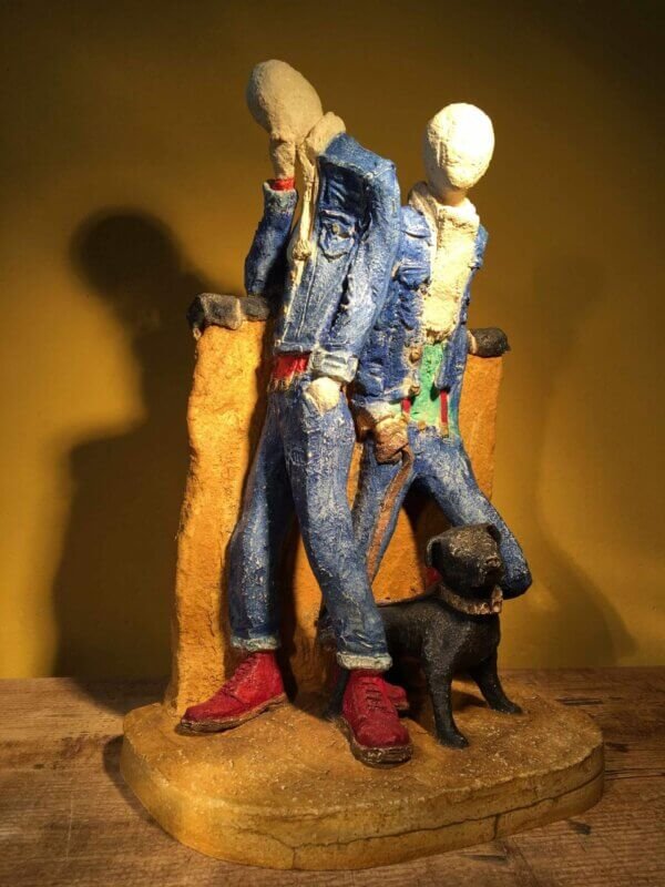 Ceramic sculpture of two skinheads with a dog