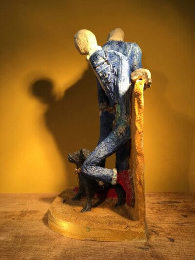 Ceramic sculpture of two skinheads with a dog