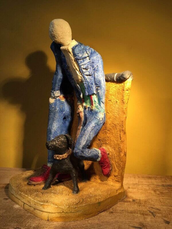 Ceramic sculpture of two skinheads with a dog