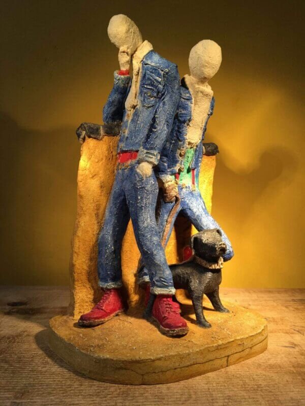 Ceramic sculpture of two skinheads with a dog