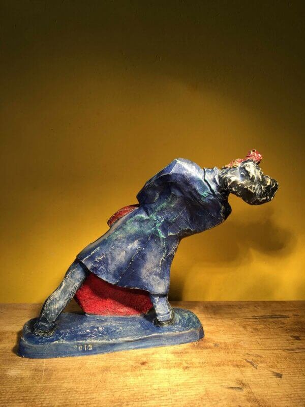 Ceramic sculpture of rockabilly bass player.