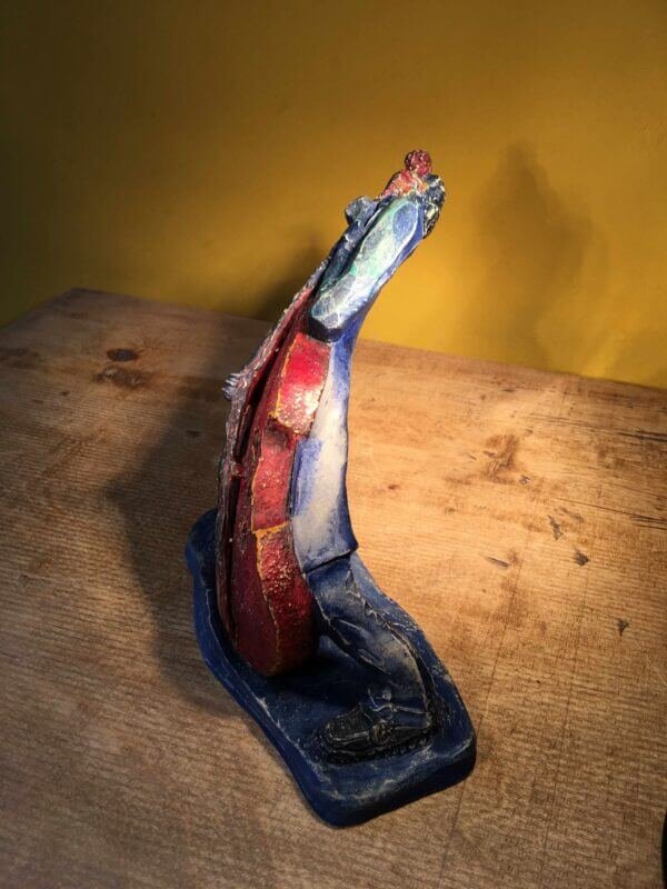 Ceramic sculpture of rockabilly bass player.
