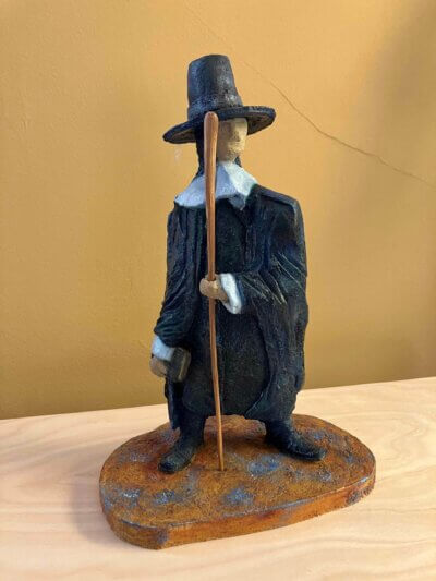 Ceramic sculpture of a Pilgrim Father preacher