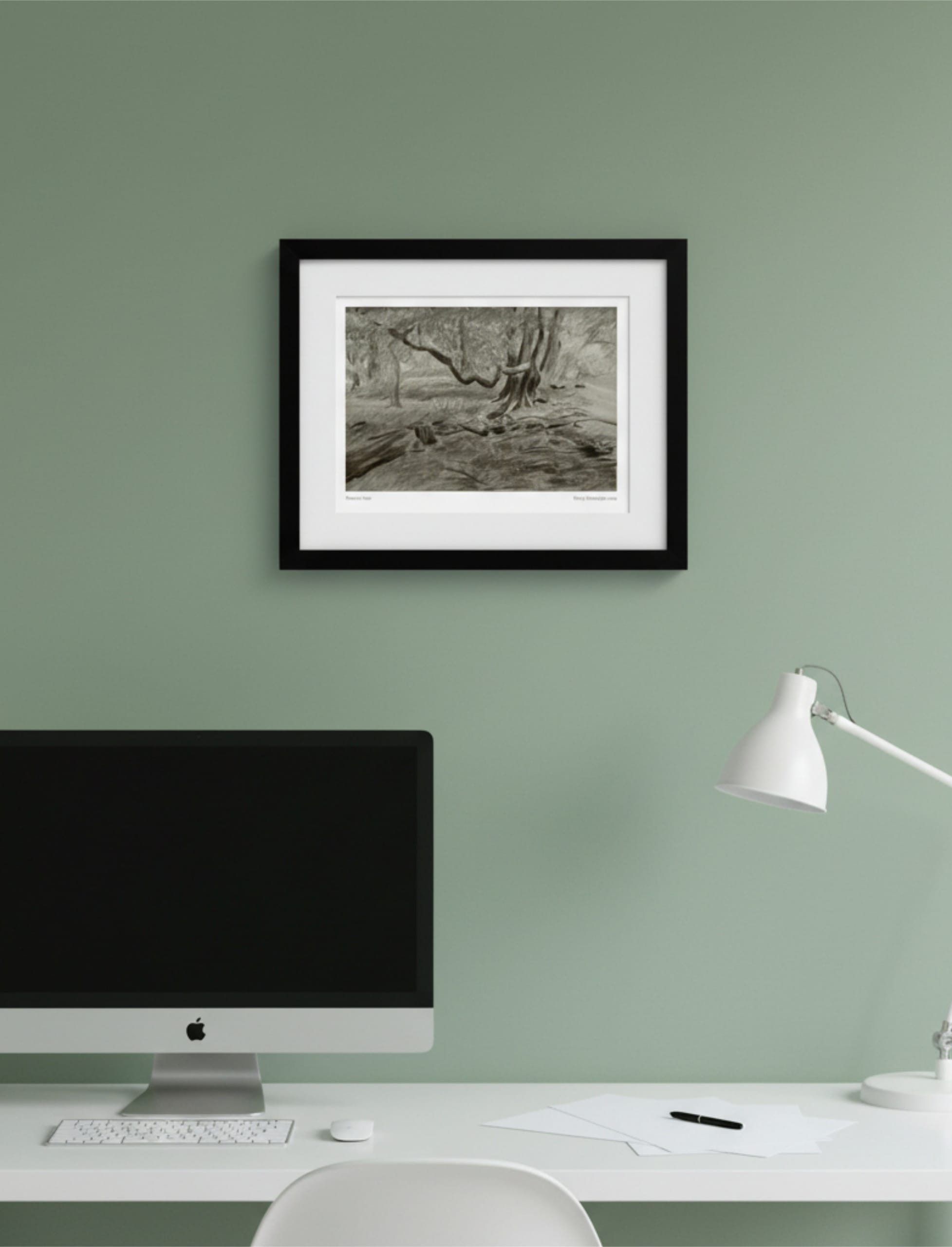 Turner's View Framed Art Print on a green wall above a desk with mac computer and lamp