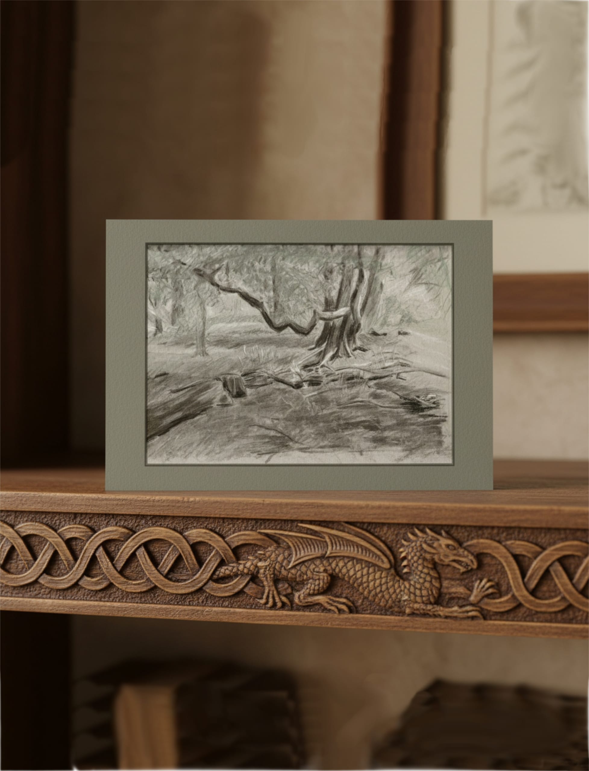 Turners View Greetings Card displayed on a table with a carved dragon edge