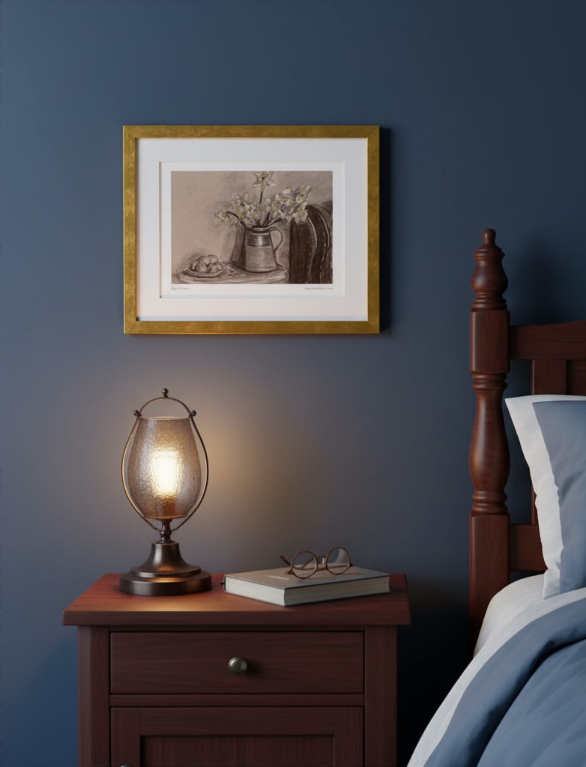 April Still Life Framed Art Print on a blue wall next to a bed above a table with a lamp and a book