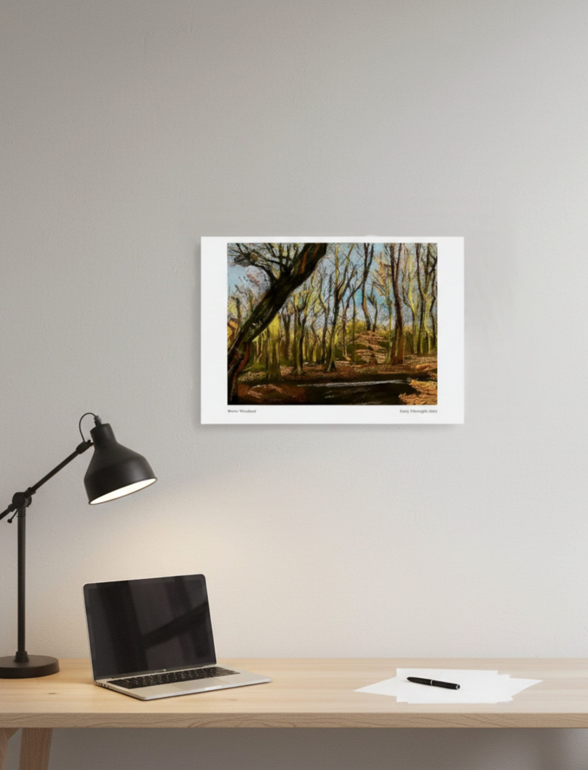 Winter Woodland Art Print ina minimalist setting above a desk with lamp