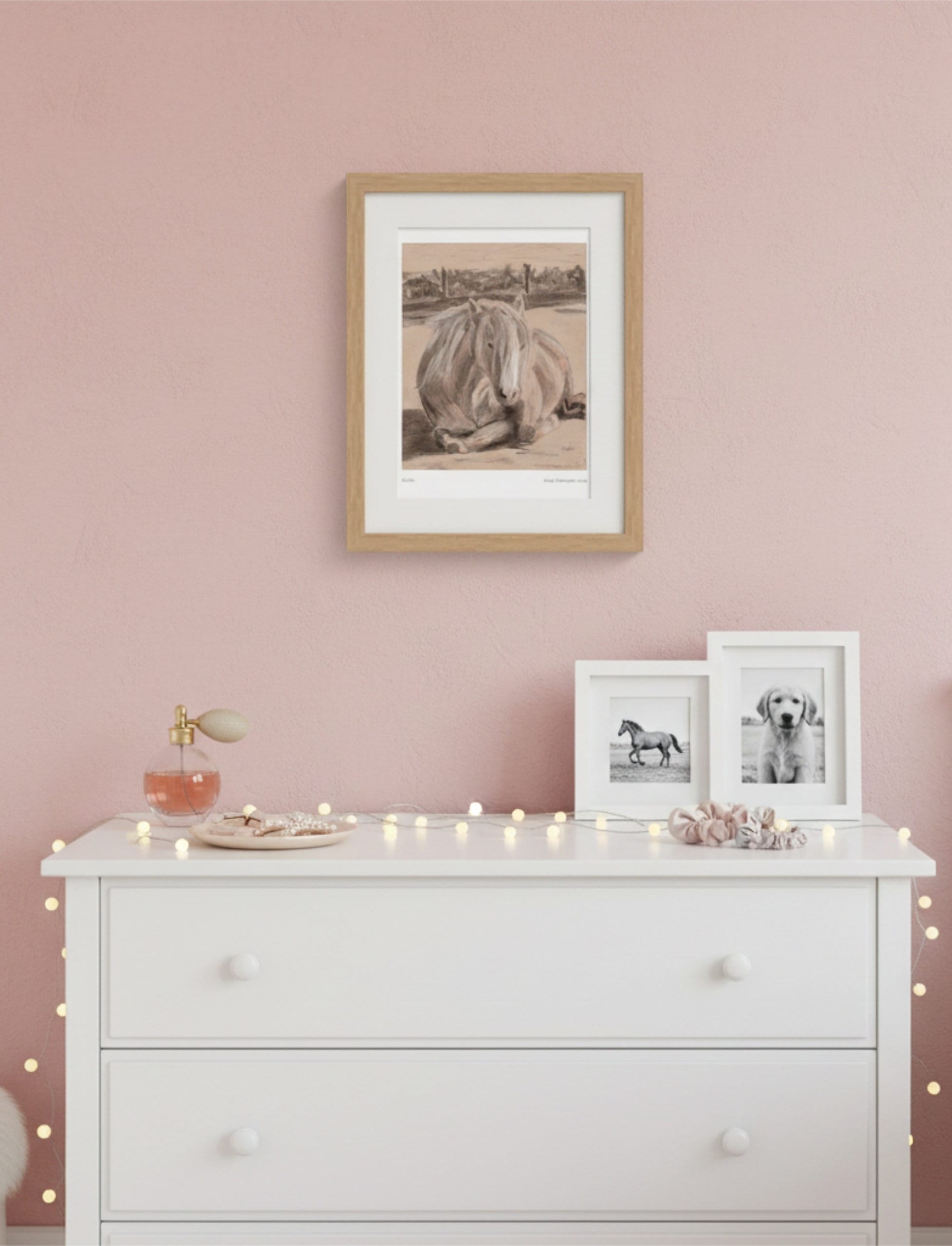 Goldie the Palomino Framed Art Print on a pink wall above a white bedroom chest