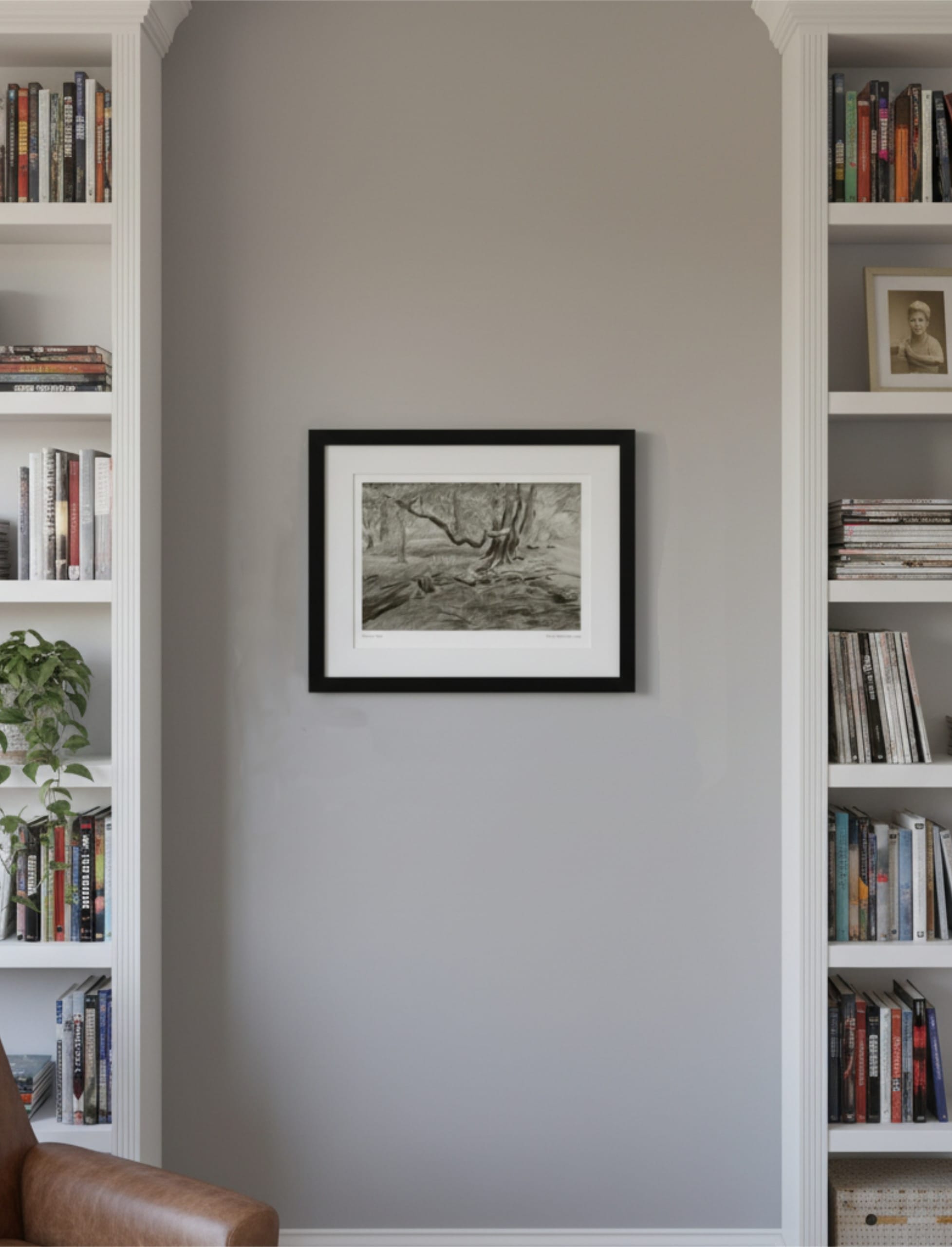 Turner's View Framed Art Print on a wall between bookcases