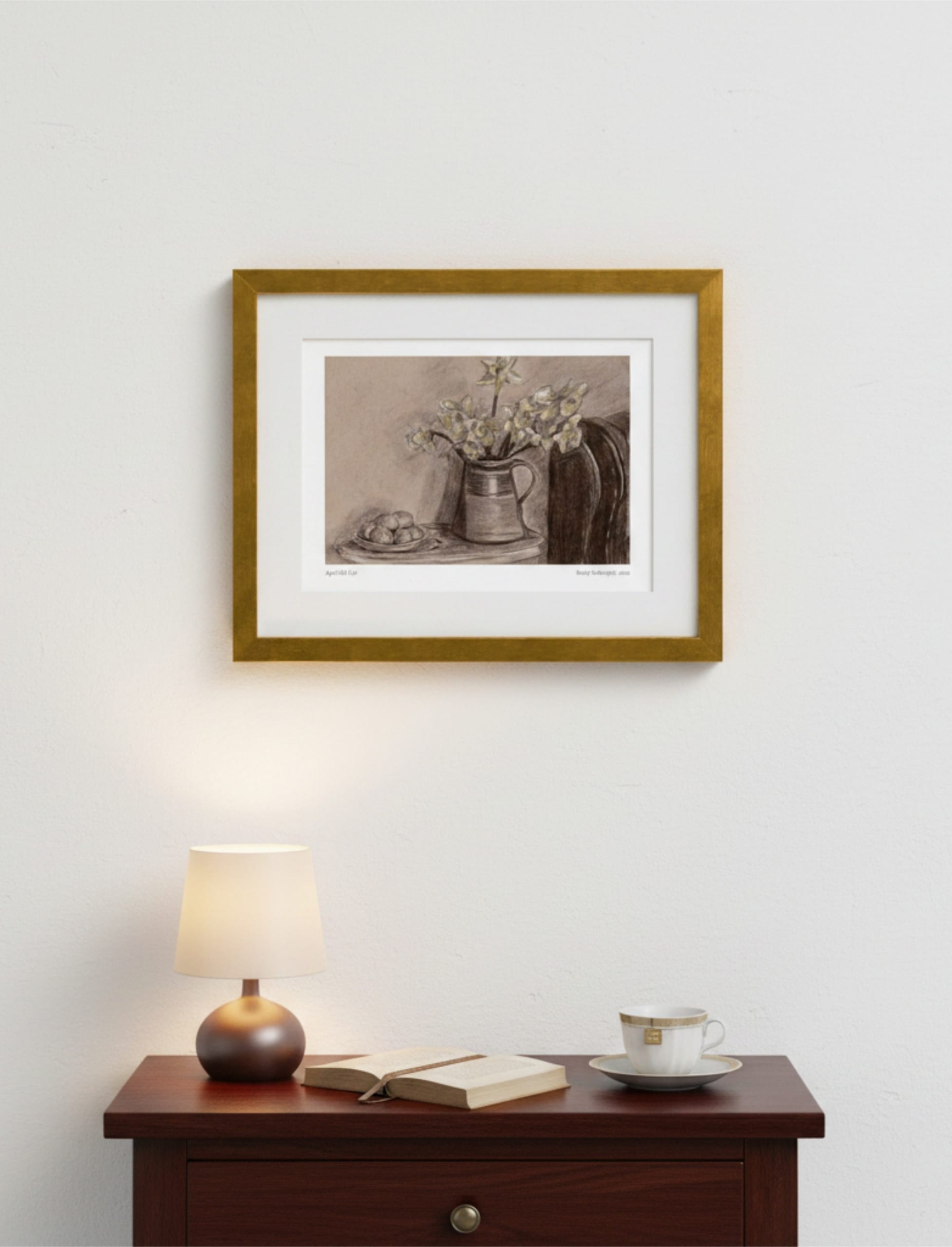 April Still Life Framed Art Print above a table with a lamp and a book and a cup