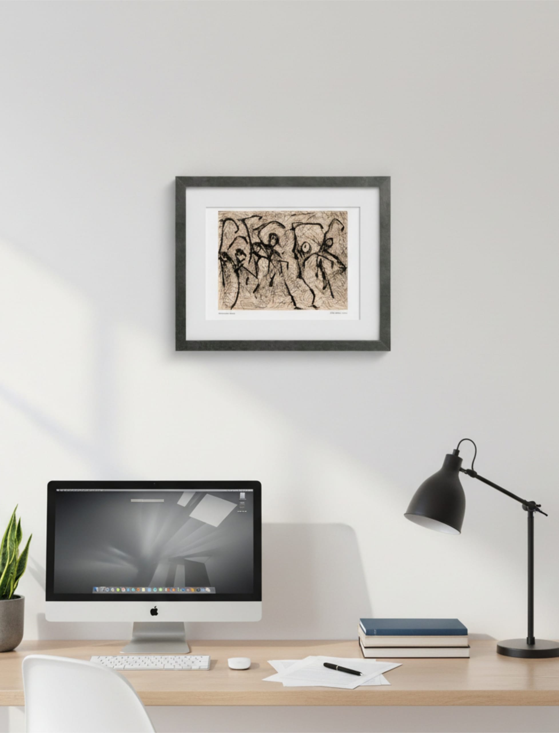 Heterodox Waltz framed art print above a desk with lamp and mac computer