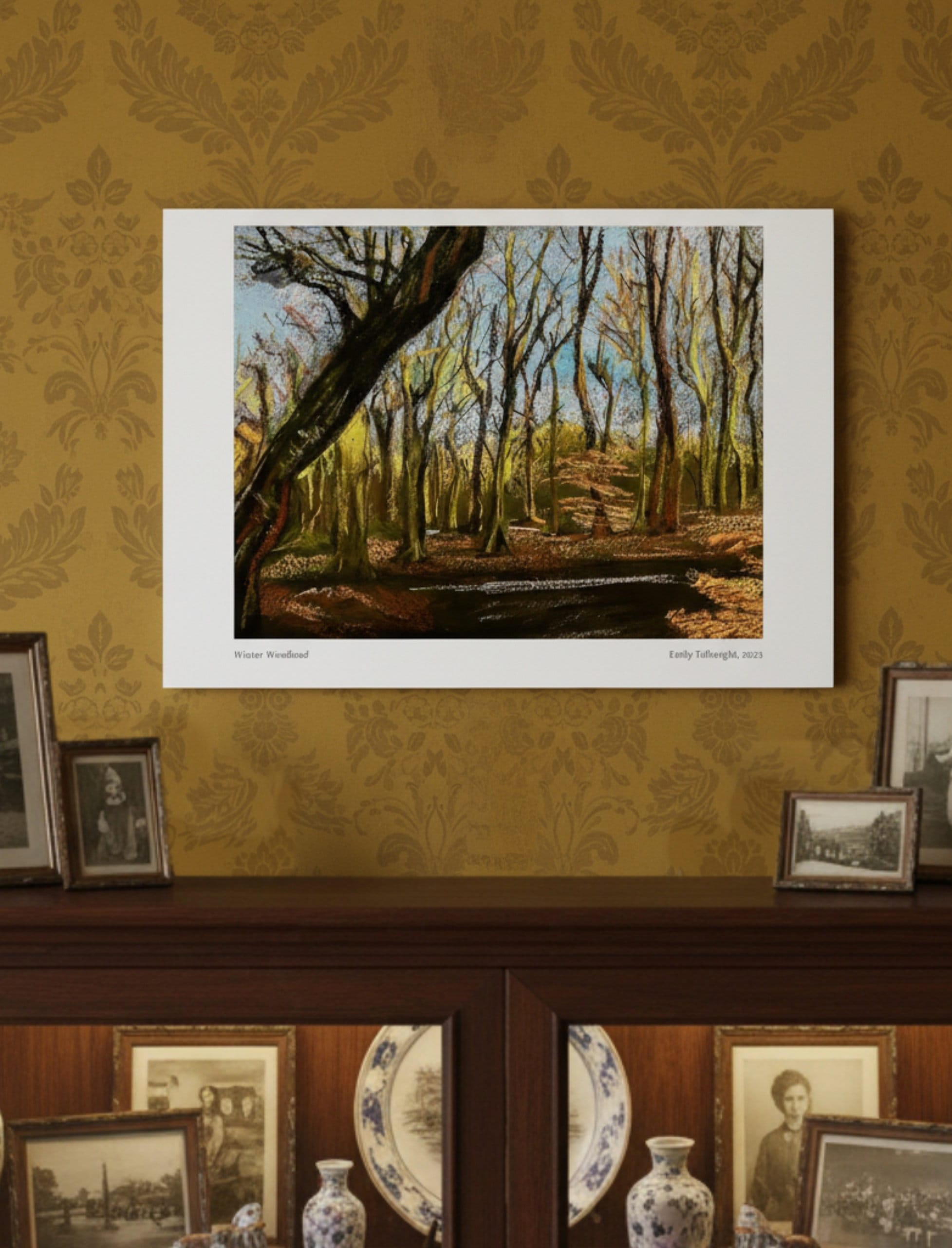 Winter Woodland Art Print above an old-fashioned china cabinet with photos