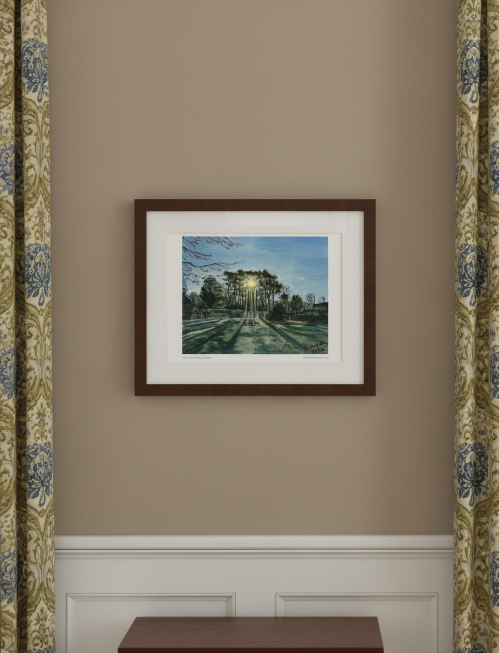 Winter Sun Through Trees Framed Art Print on the wall between patterned curtains