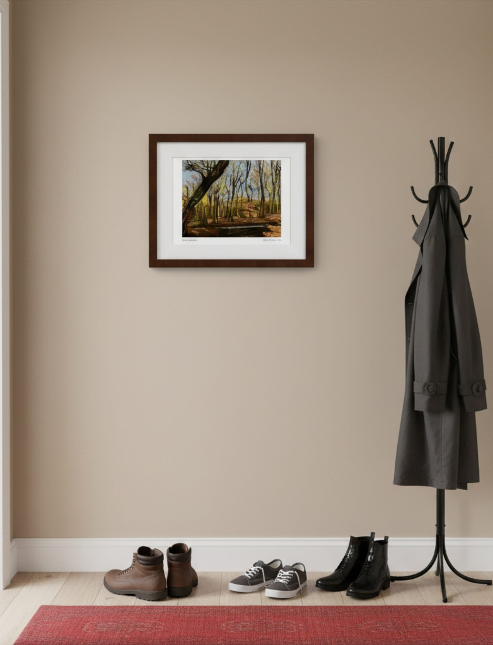 Winter Woodland Framed Art Print in a hall with a coat on a stand and a selection of shoes