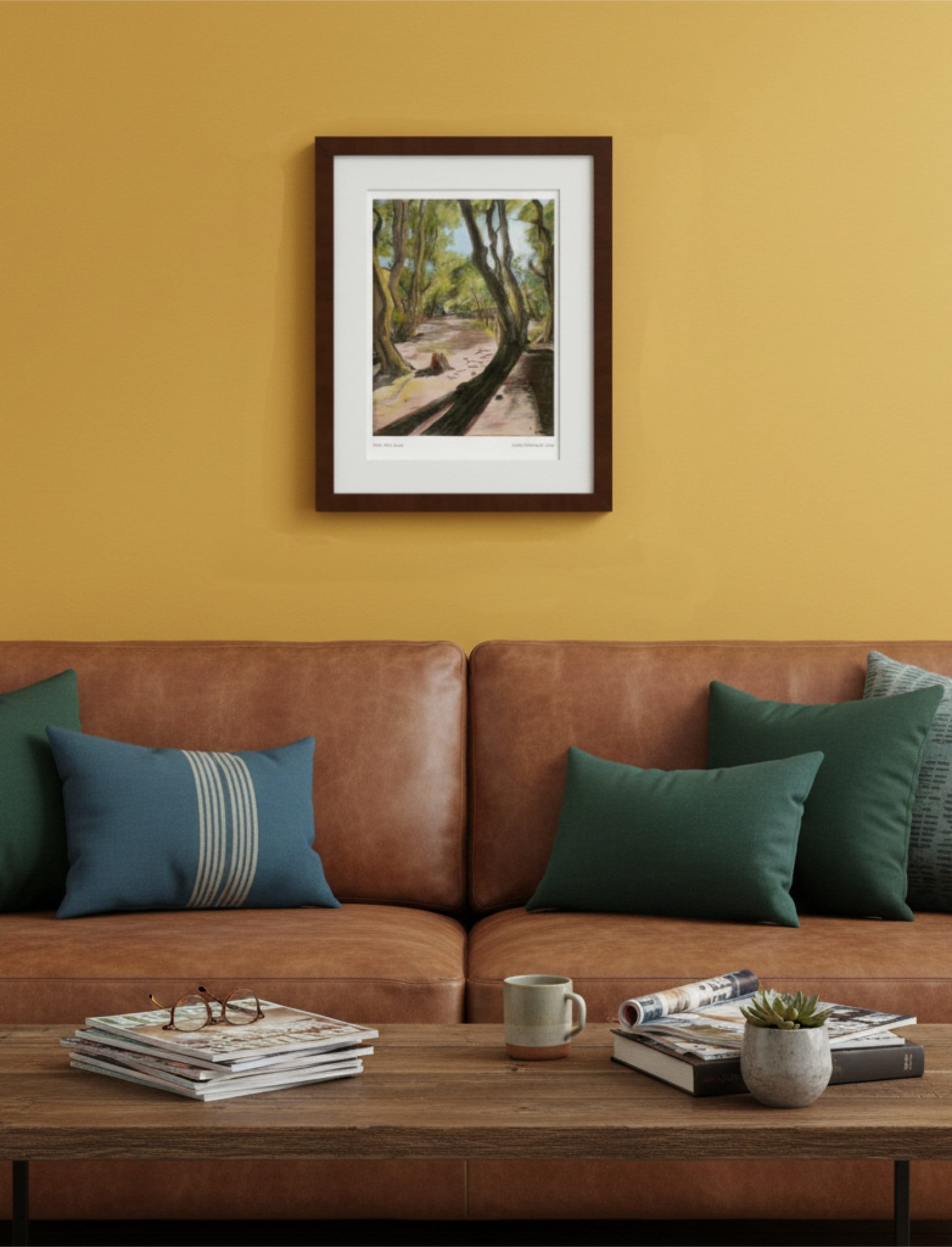 Path After Lines framed Art Print above a brown leather sofa and a coffee table