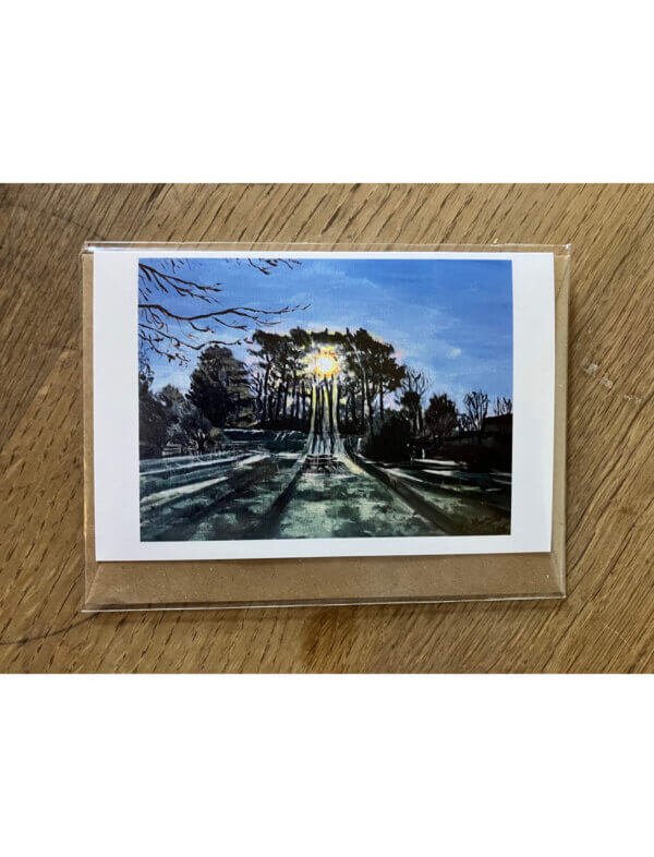 Greetings card showing an acrylic painting of sun shining through pine trees
