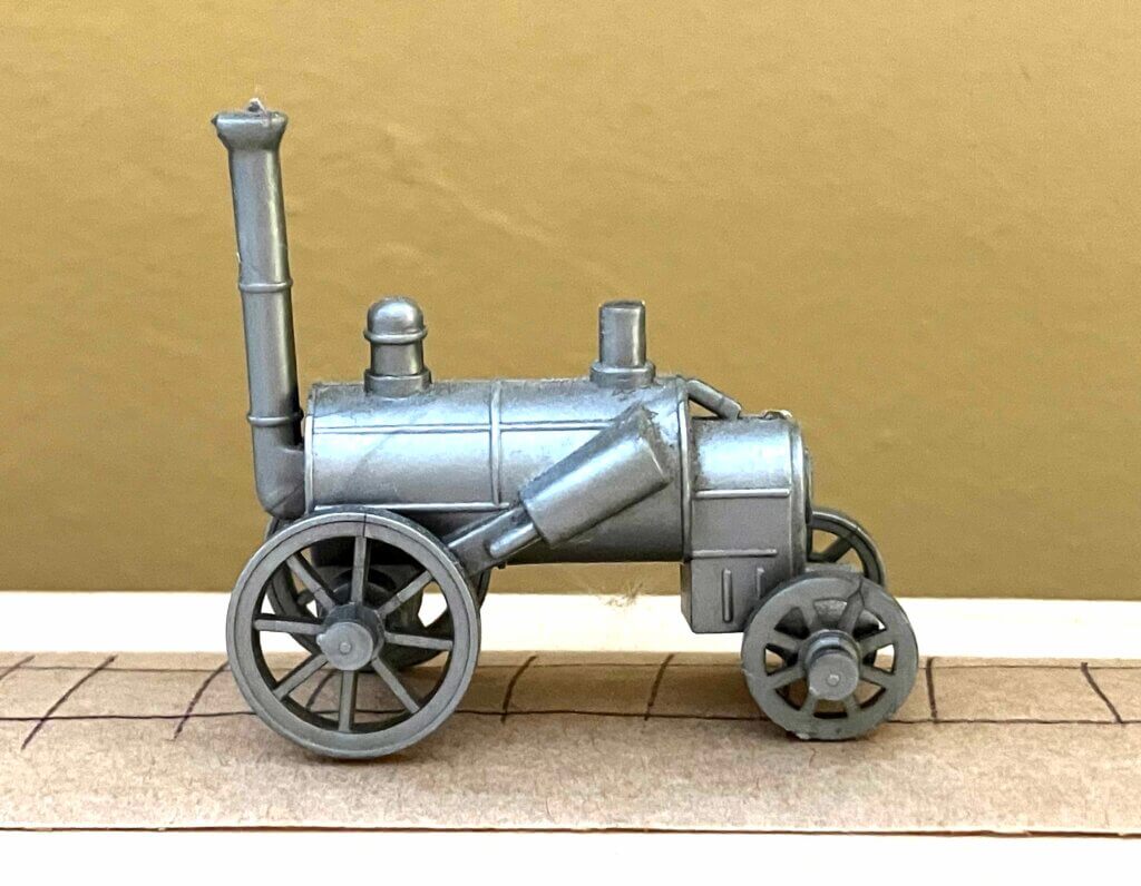 Photo of a model of an ancient locomotive.
