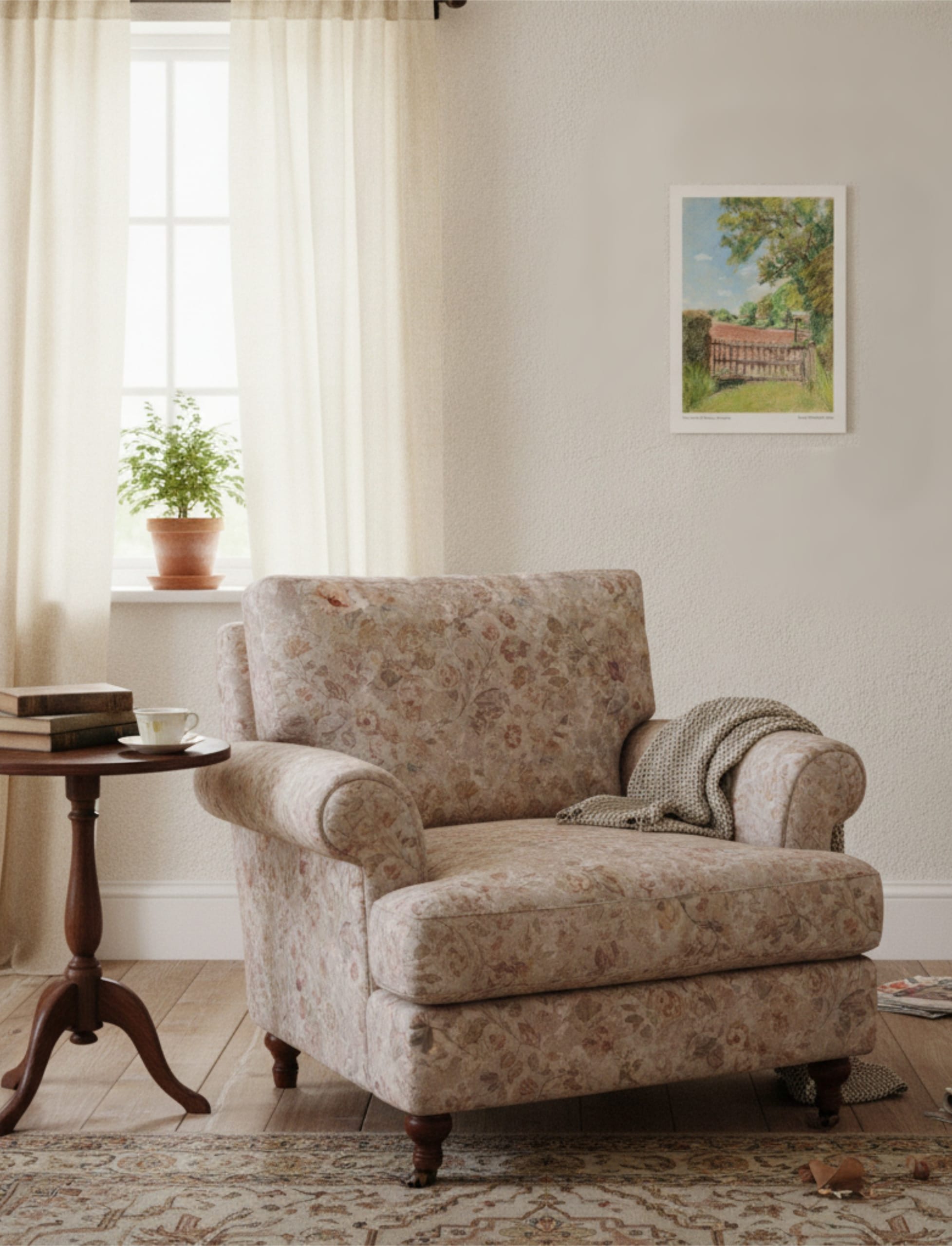 The view from St Mary's Kempley Art Print on the wall a comfortable chair next to a small side table with a plant in the background