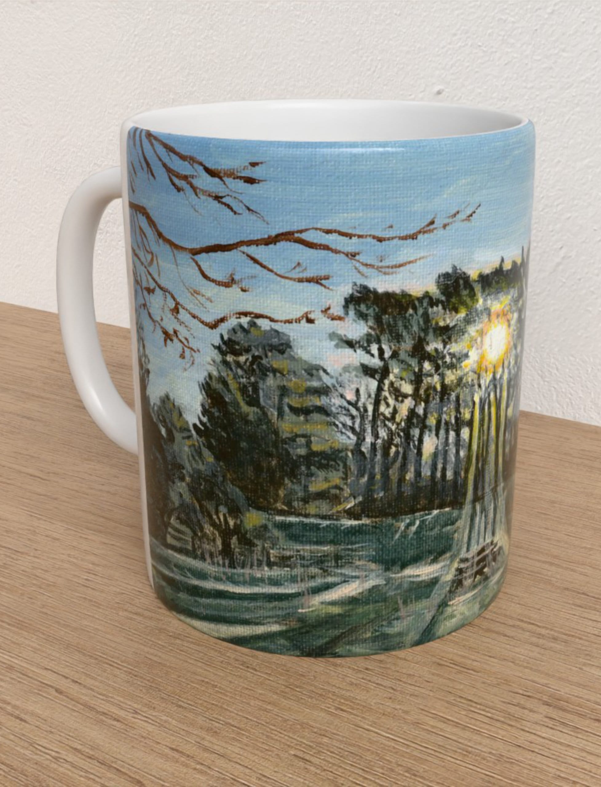 Winter Sun Through trees mug showing an acrylitc painting of winter woodland