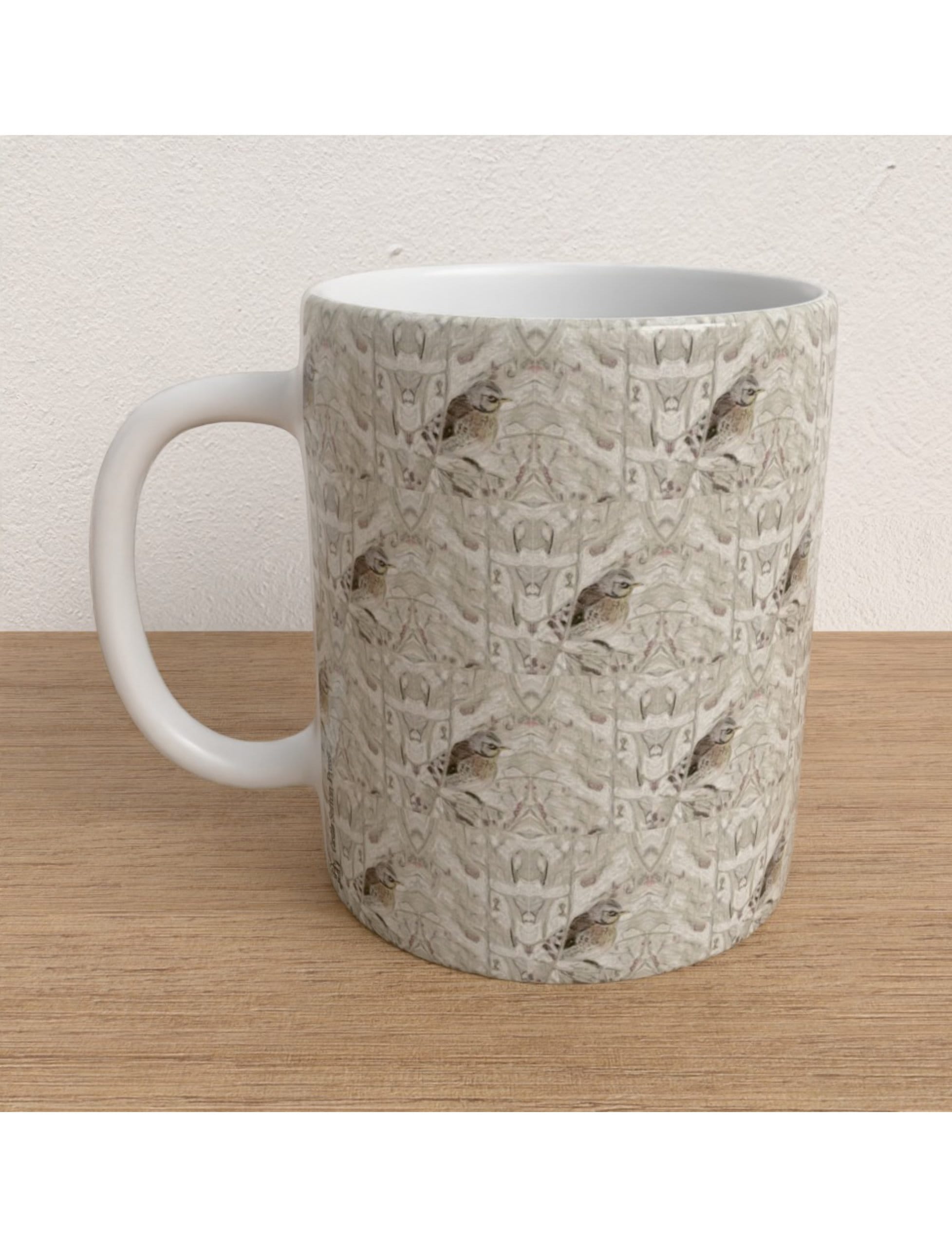 Winter Bird Mug featuring a hand-drawn fieldfare design by Emily Tellwright