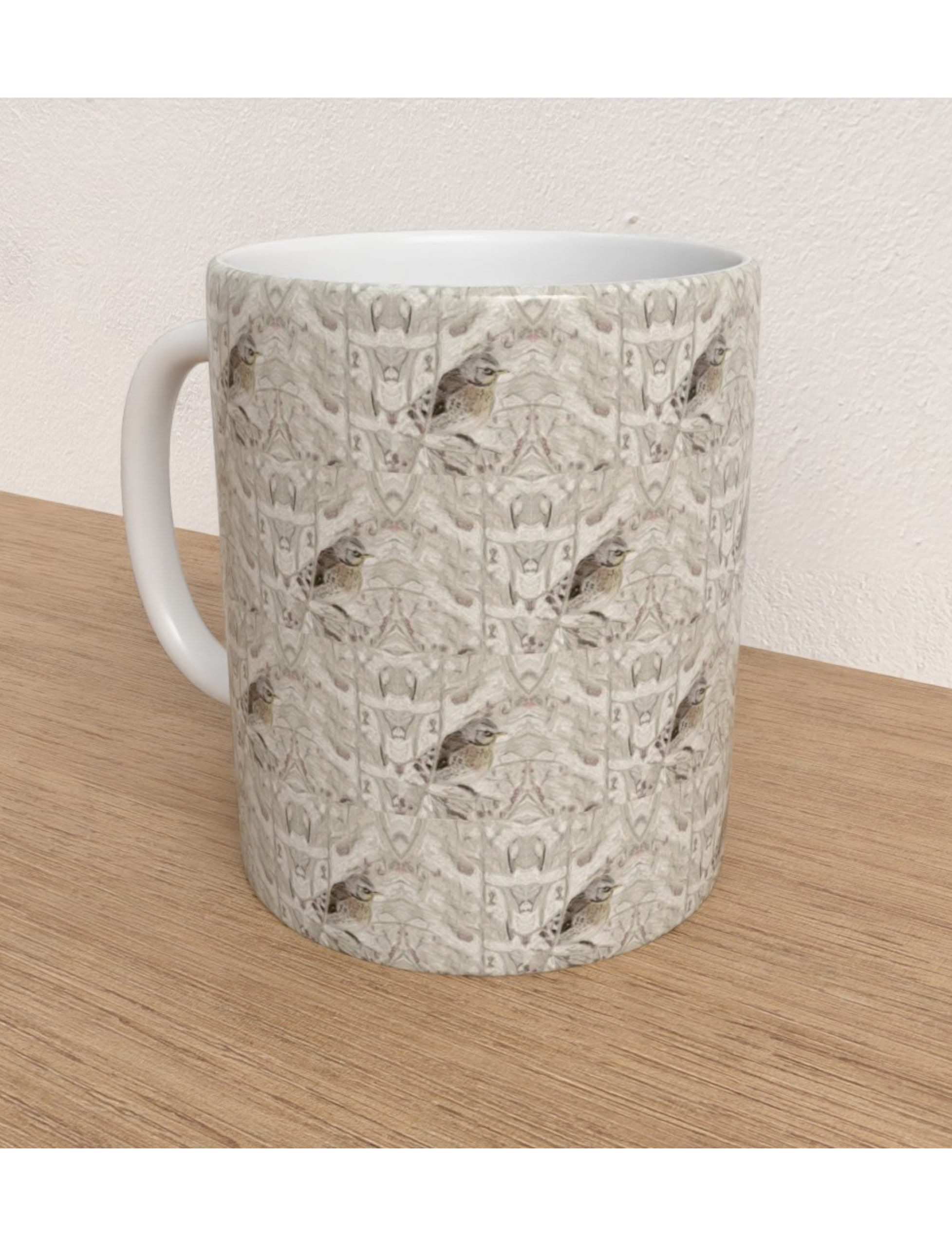 Winter Bird Mug featuring a hand-drawn fieldfare design by Emily Tellwright