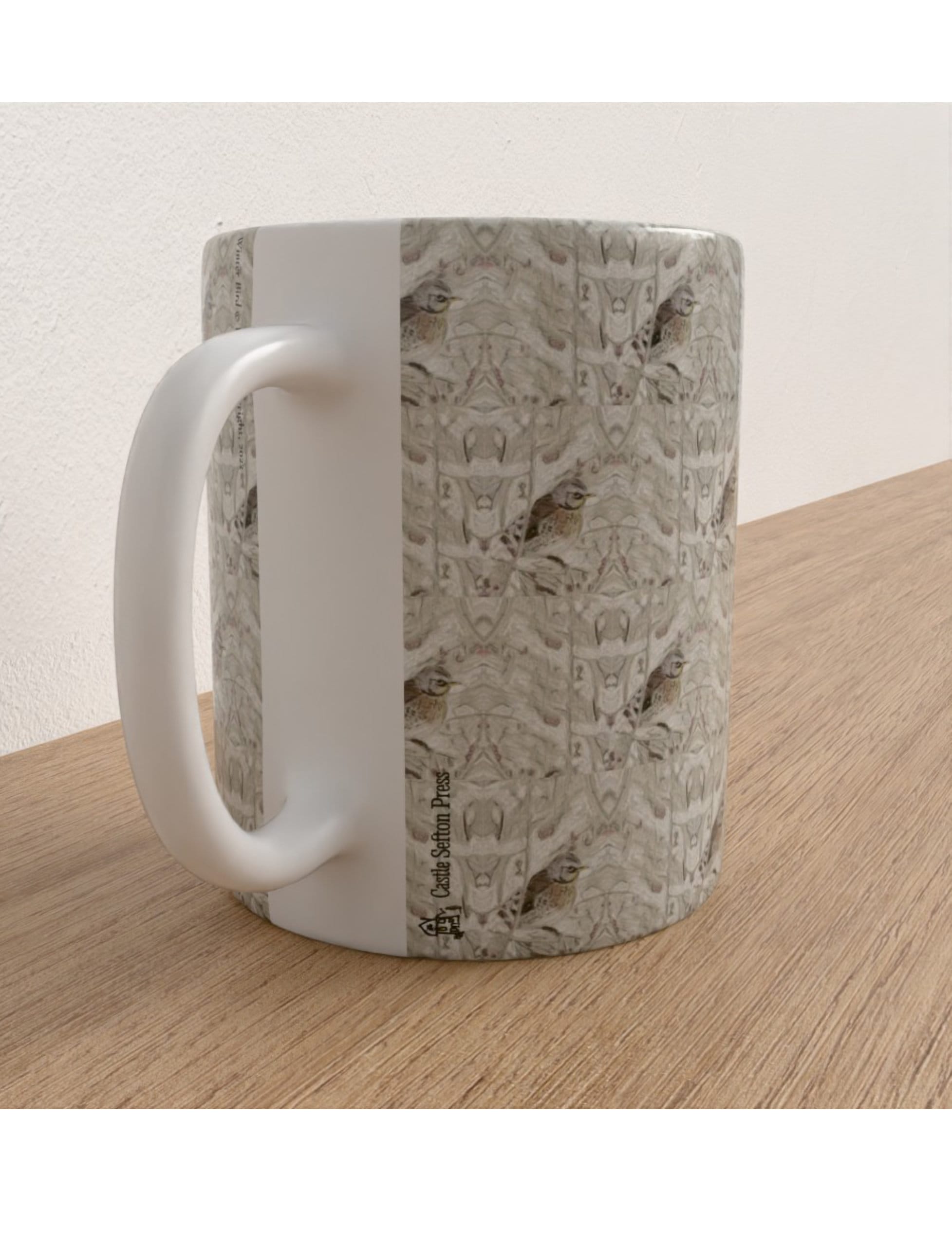 Winter Bird Mug featuring a hand-drawn fieldfare design by Emily Tellwright
