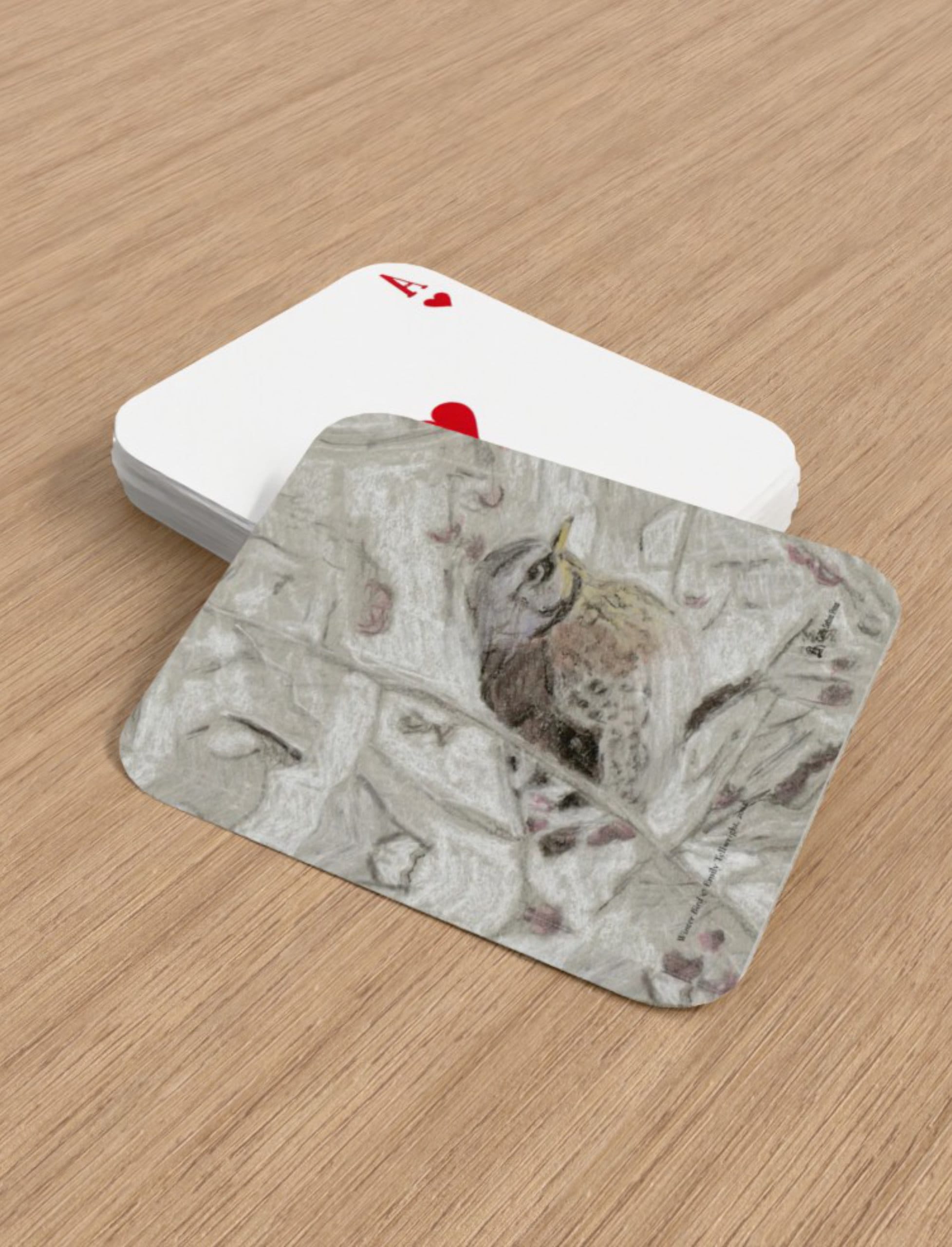 Winter Bird playing cards showing a drawing of a filedfare by Emily Tellwright