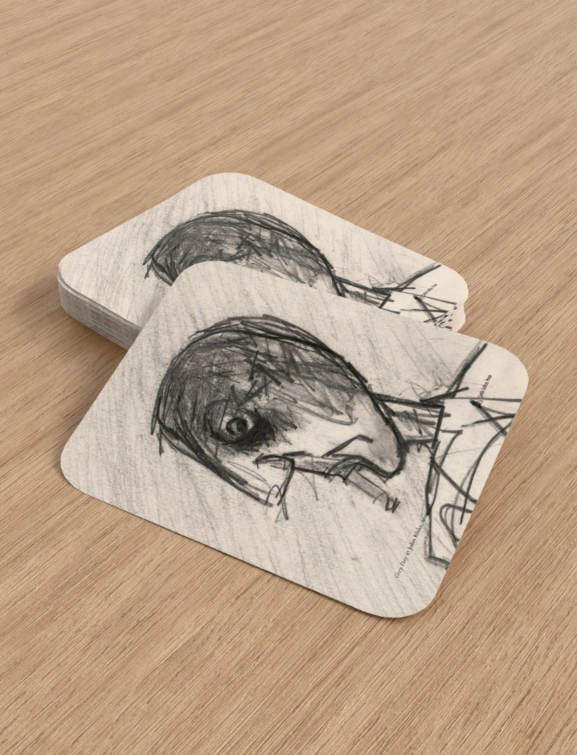 Grey Day Playing Cards showing a pencil drawing of a head smoking by John Blake