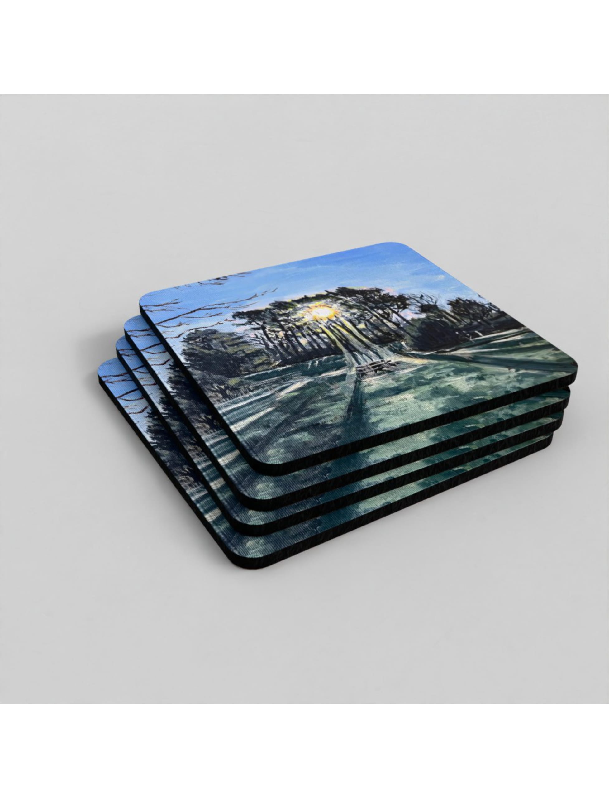 Winter sun Through Trees coasters showing an acrylic painting by Emily Tellwright