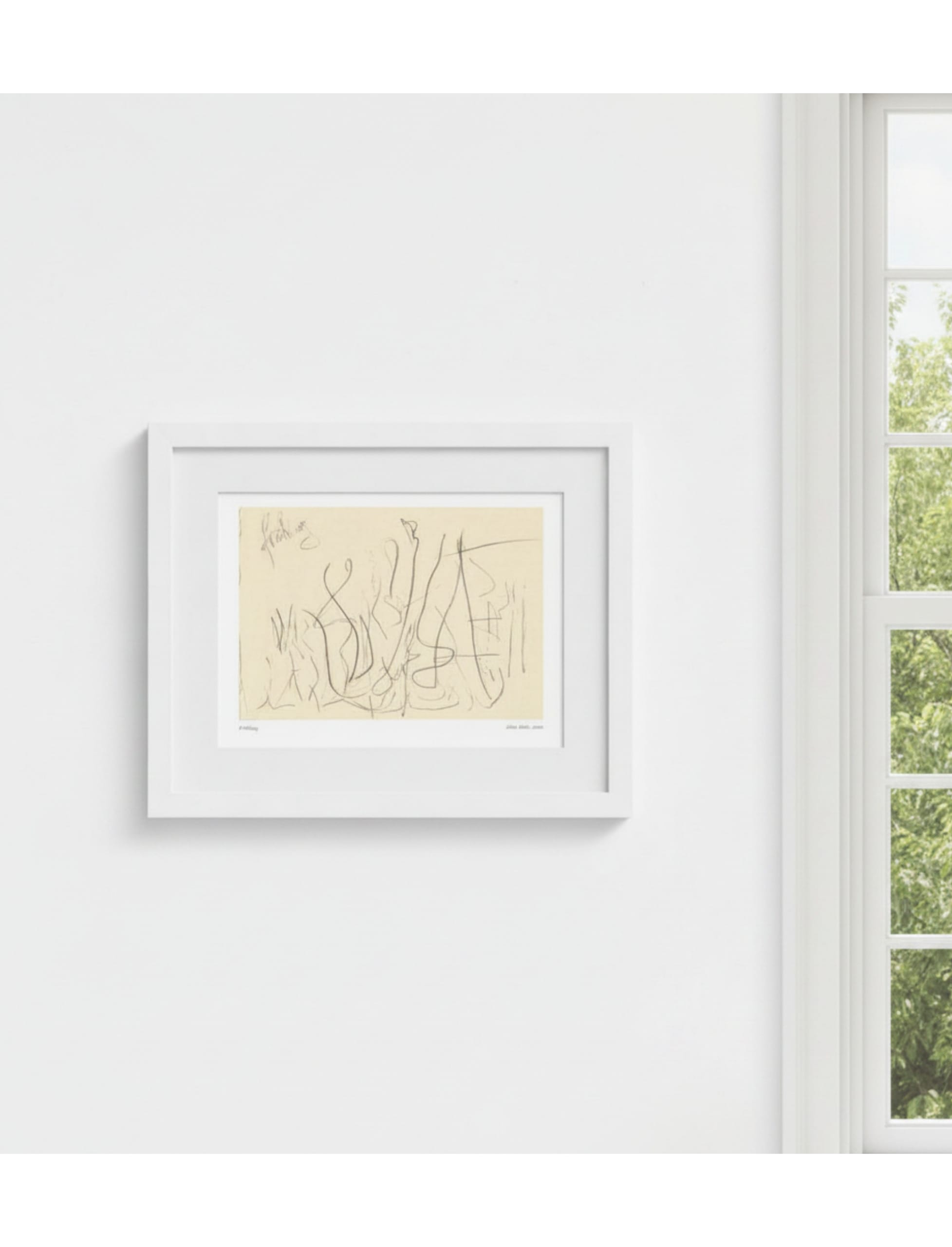fruhling framed art print next to a window