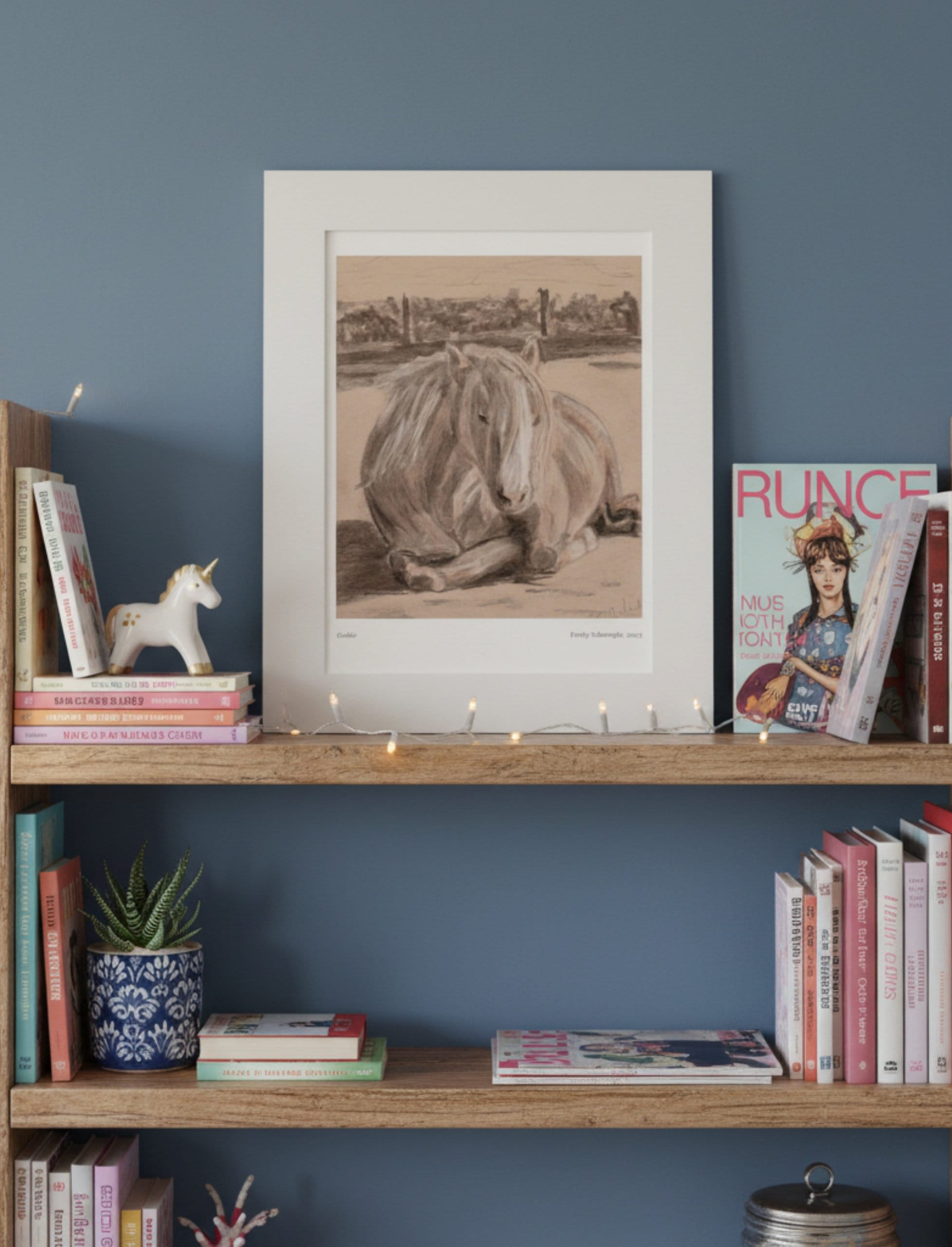 Goldie the palomino mounted art print on pine book shelves in front of a blue wall